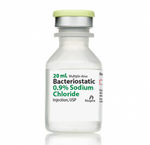 A 20mL multiple-dose vial of Bacteriostatic NaCl (Sodium Chloride) 0.9% with a green cap, branded by Henry Schein.